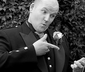 Male Wedding Guest pointing to pocket watch
