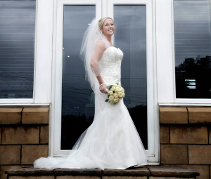 Bride standing with bouquet