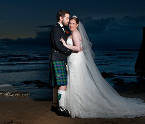 Married Man and Woman on beach at night